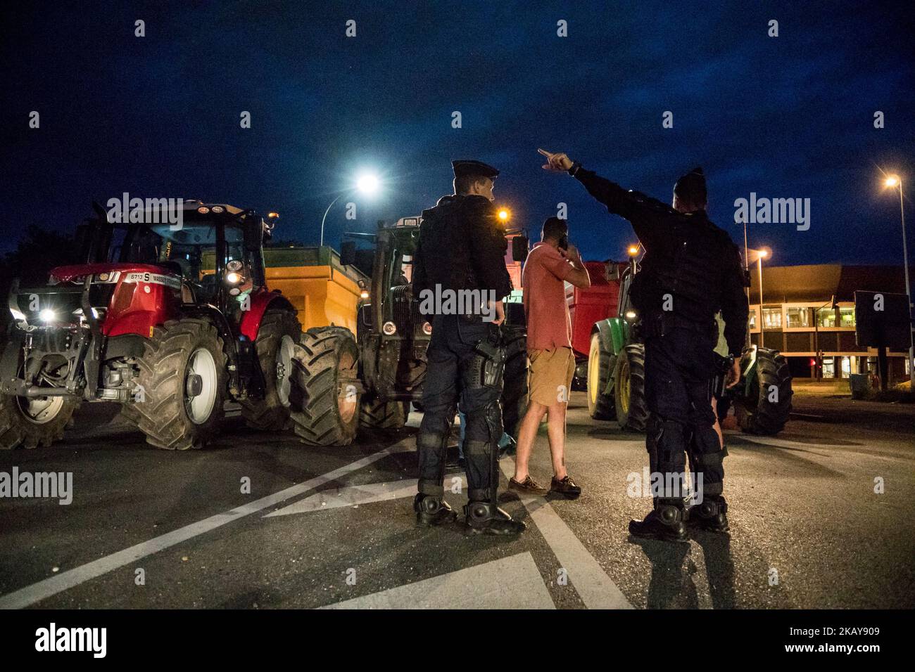 Blockade of the fuel depot Edouard Herriot port by farmers FNSEA and Young Farmers in Lyon, France, June 11, 2018. Protesters are against the revision of European financial aid, as well as against the massive importation of palm oil. Several refineries and fuel depots were blocked for a period of three days. (Photo by Nicolas Liponne/NurPhoto) Stock Photo