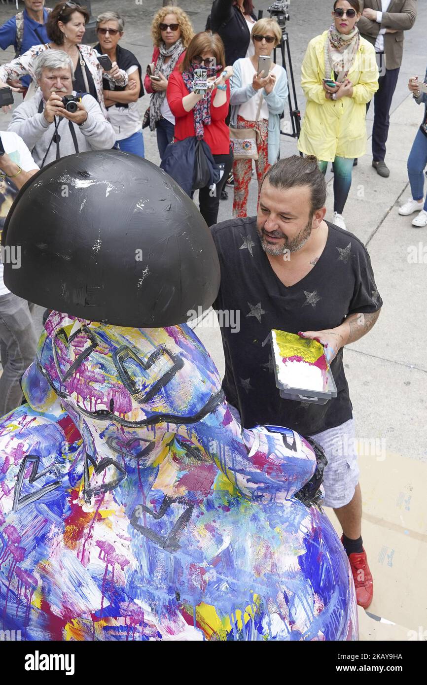 The artist Domingo Zapata restores his artwork, the menina 'La vida es sueno', in front of Queen Sofia Museum on June 11, 2018 in Madrid, Spain. This artwork takes part of the 80 sculptures in the shape of Las Meninas by the painter Velazquez, fiberglass staves decorated by artists, musicians, actors or designers to promote the city as Capital of Fashion are exhibited in the centre of Madrid (Photo by Oscar Gonzalez/NurPhoto) Stock Photo