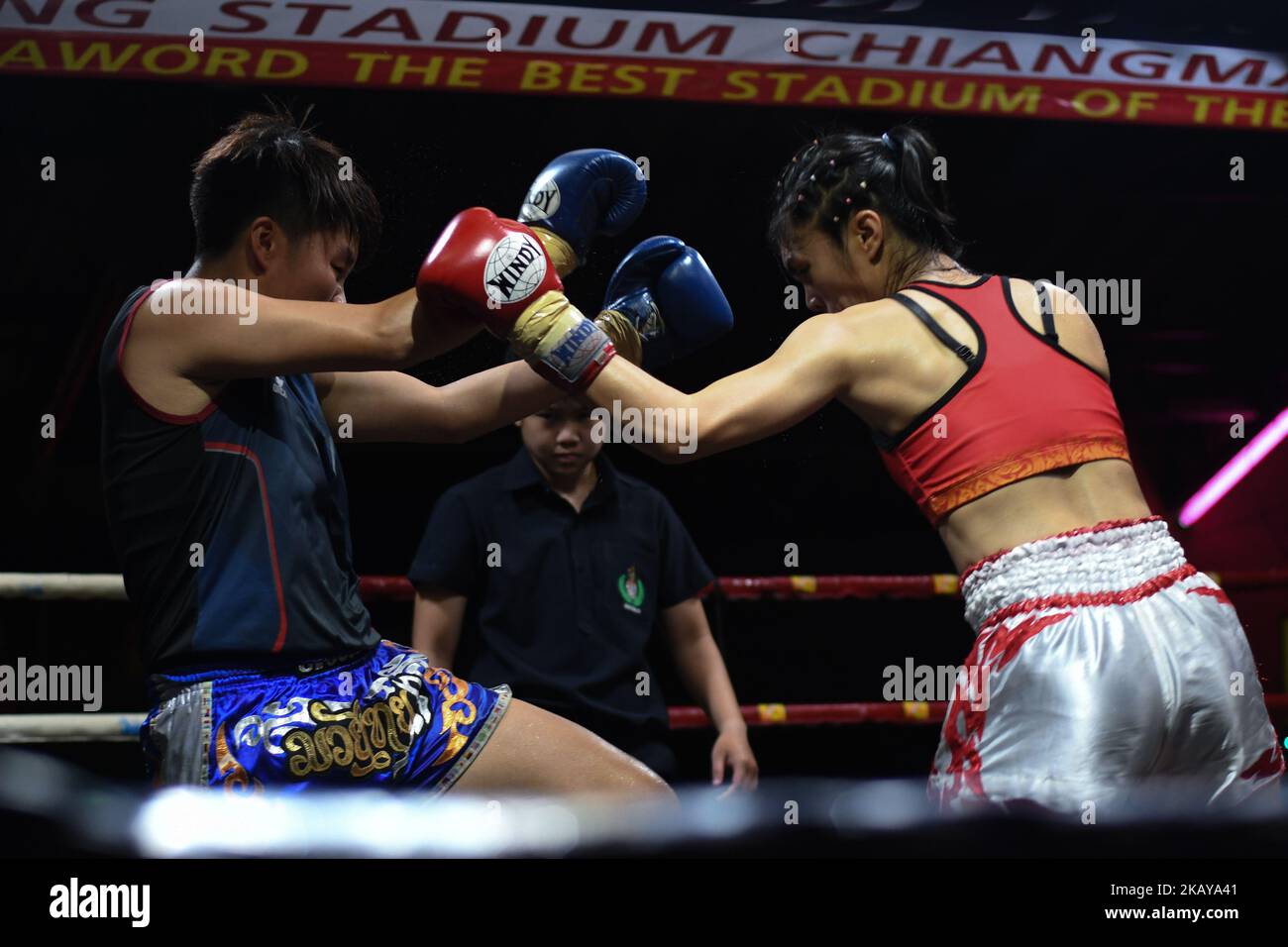 Thai boxing combat between Chabaphai (Red) vs Gwungthong (Blue) in Ladies 58kg category, during Muaythai Monday Evening International Thai Boxing Gala in Thaphae Stadium in Chiang Mai. On Monday, June 11, 2018, Chiang Mai, Chiang Mai Province, Thailand. (Photo by Artur Widak/NurPhoto)  Stock Photo