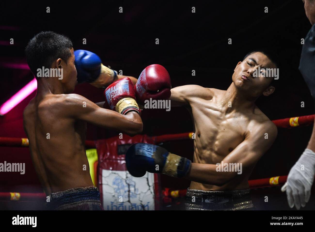 Thai boxing combat between Aekapol (Red) vs Nong (Blue) in -50kg category, during Muaythai Monday Evening International Thai Boxing Gala in Thaphae Stadium in Chiang Mai. On Monday, June 11, 2018, Chiang Mai, Chiang Mai Province, Thailand. (Photo by Artur Widak/NurPhoto)  Stock Photo