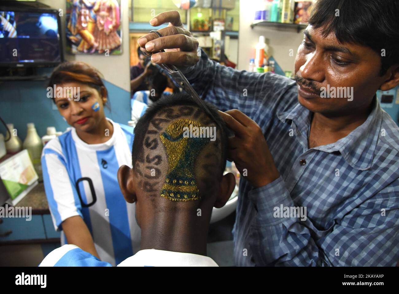 Indian Hair cutter and Artist Robin Das makes the new Hairstyle FIFA World Cup 2018 trophy ahead of the upcoming FIFA Russia 2018 World Cup, in Near of Kolkata City on June 13, 2018,India. (Photo by Debajyoti Chakraborty/NurPhoto) Stock Photo