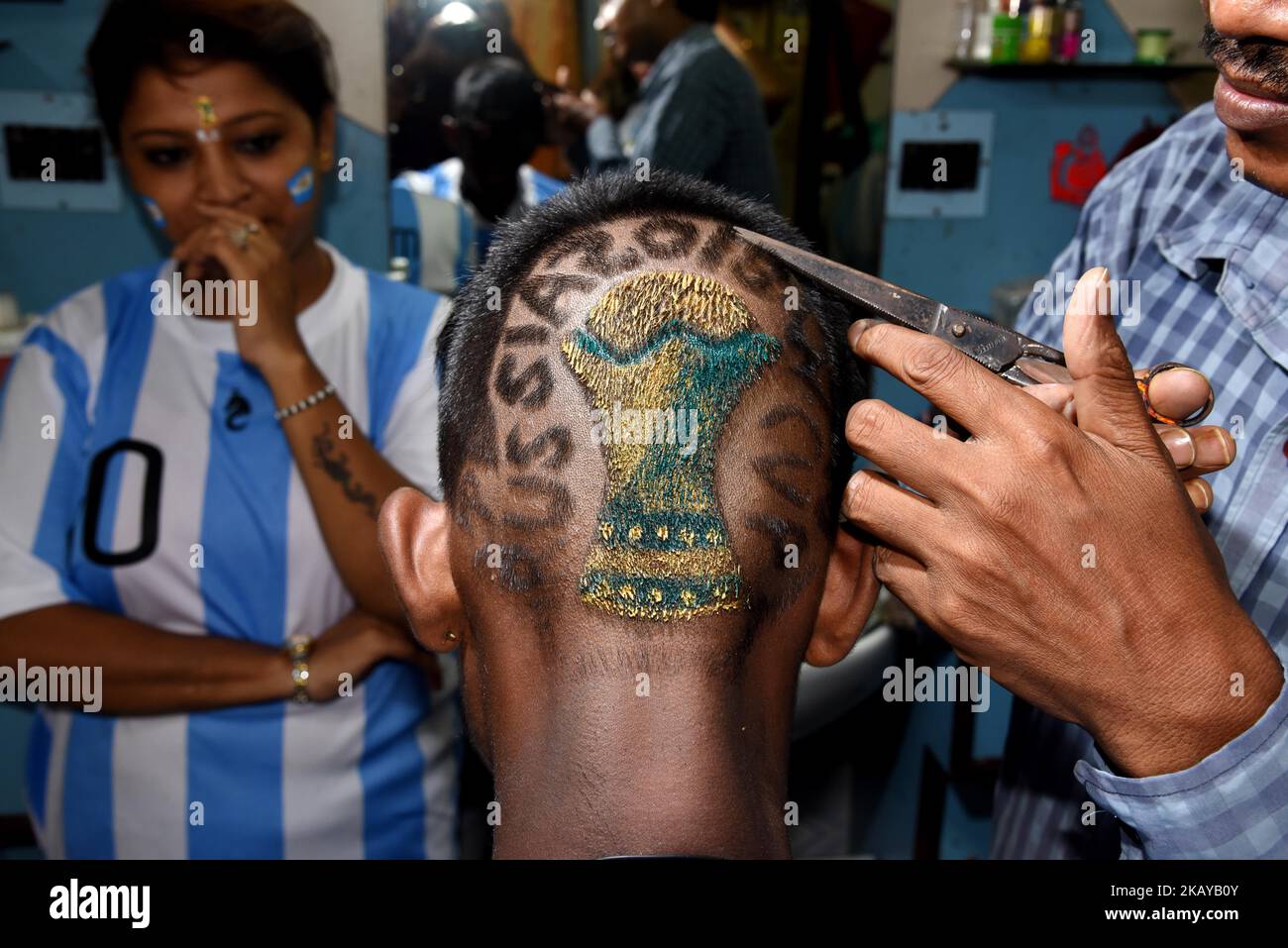 Indian Hair cutter and Artist Robin Das makes the new Hairstyle FIFA World Cup 2018 trophy ahead of the upcoming FIFA Russia 2018 World Cup, in Near of Kolkata City on June 13, 2018,India. (Photo by Debajyoti Chakraborty/NurPhoto) Stock Photo