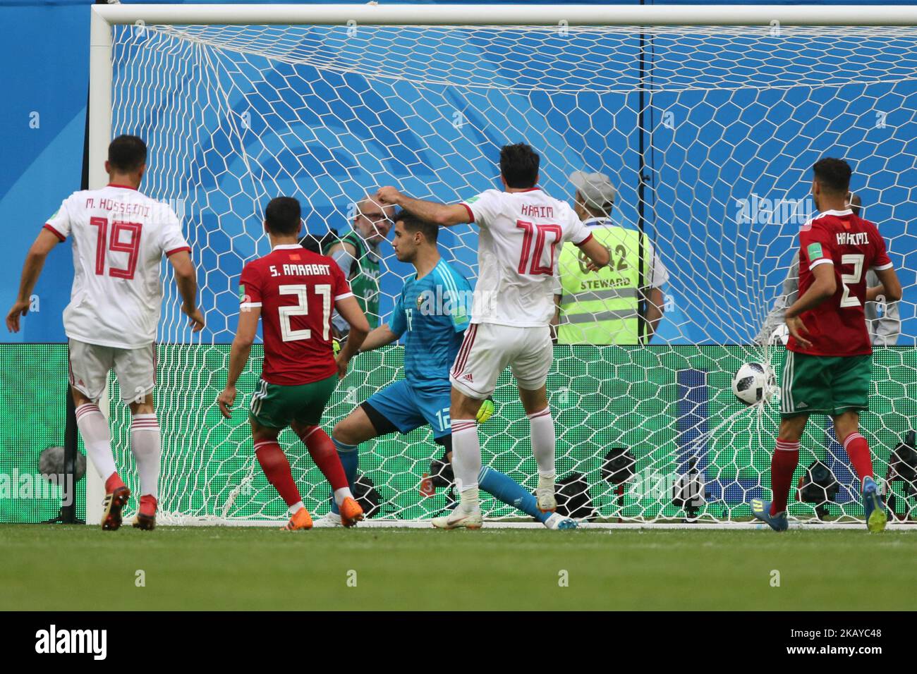 Majid Hosseini (L) of the Iran national football team and Sofyan Amrabat of the Morocco national football team vie for the ball during the 2018 FIFA World Cup match, first stage - Group B between Morocco and Iran at Saint Petersburg Stadium on June 15, 2018 in St. Petersburg, Russia. (Photo by Igor Russak/NurPhoto) Stock Photo