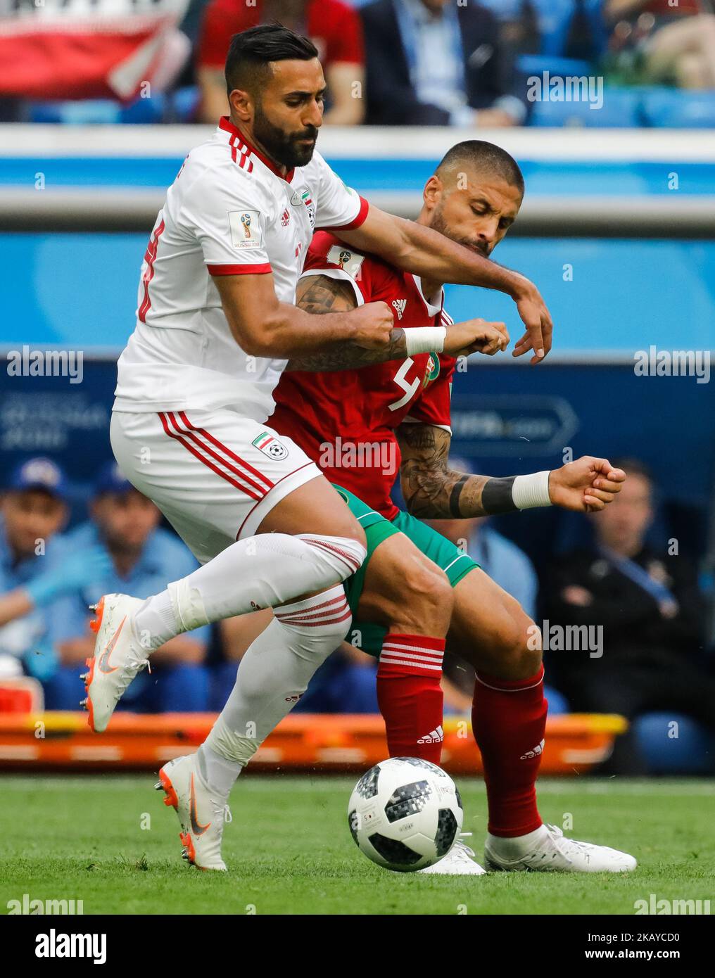 Manuel Da Costa (R) of Morocco national team and Saman Ghoddos of IR Iran national team vie for the ball during the 2018 FIFA World Cup Russia Group B match between Morocco and IR Iran on June 15, 2018 at Saint Petersburg Stadium in Saint Petersburg, Russia. (Photo by Mike Kireev/NurPhoto) Stock Photo