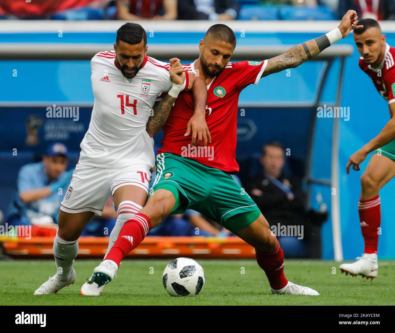 Manuel Da Costa (C) of Morocco national team and Saman Ghoddos of IR Iran national team vie for the ball during the 2018 FIFA World Cup Russia Group B match between Morocco and IR Iran on June 15, 2018 at Saint Petersburg Stadium in Saint Petersburg, Russia. (Photo by Mike Kireev/NurPhoto) Stock Photo