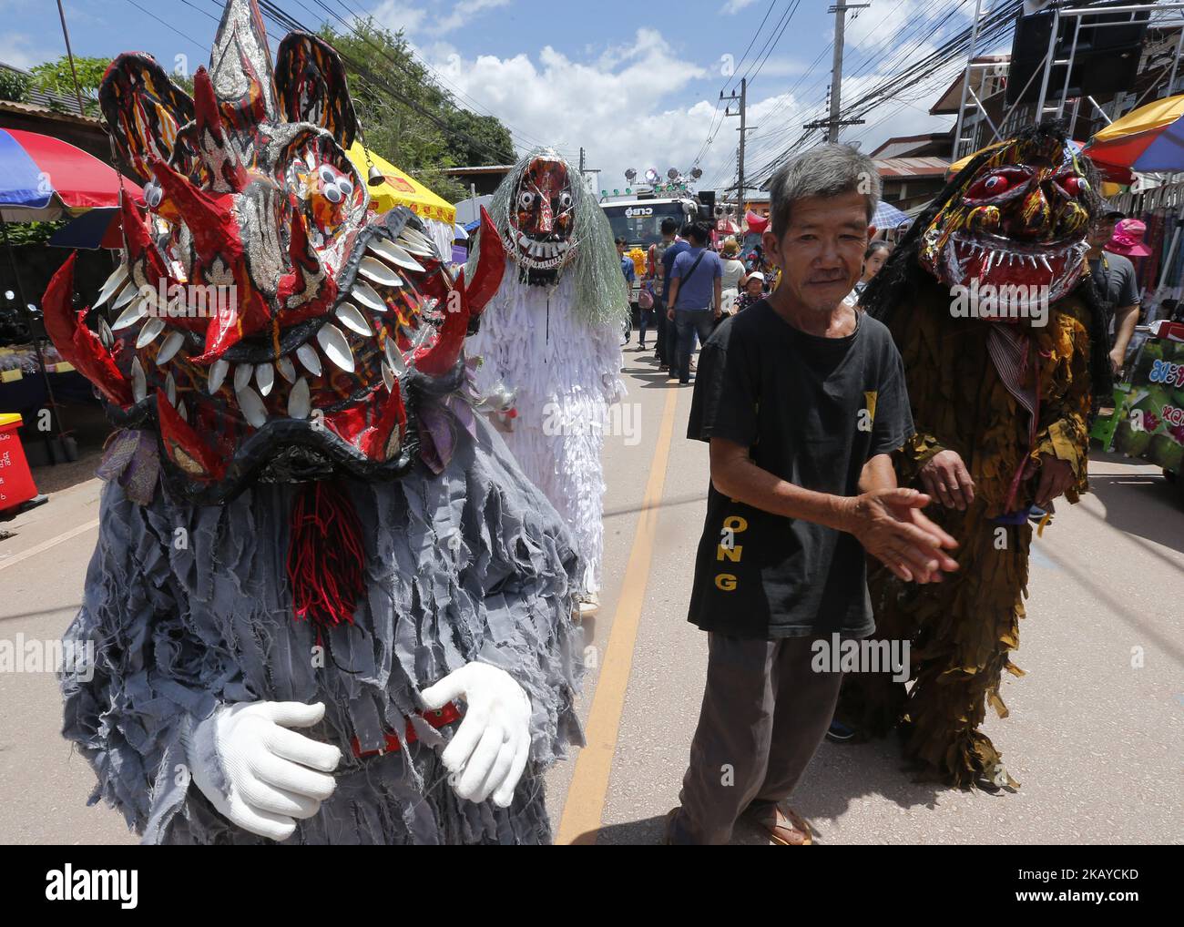 Thais wear masks representing the spirits of the dead springing back to life during the annual Phi Ta Khon, or Ghost festival in Dan Sai, Loei province, northeast of Bangkok on June 16, 2018. The event was held to promote tourism in Thailand. (Photo by Chaiwat Subprasom/NurPhoto) Stock Photo