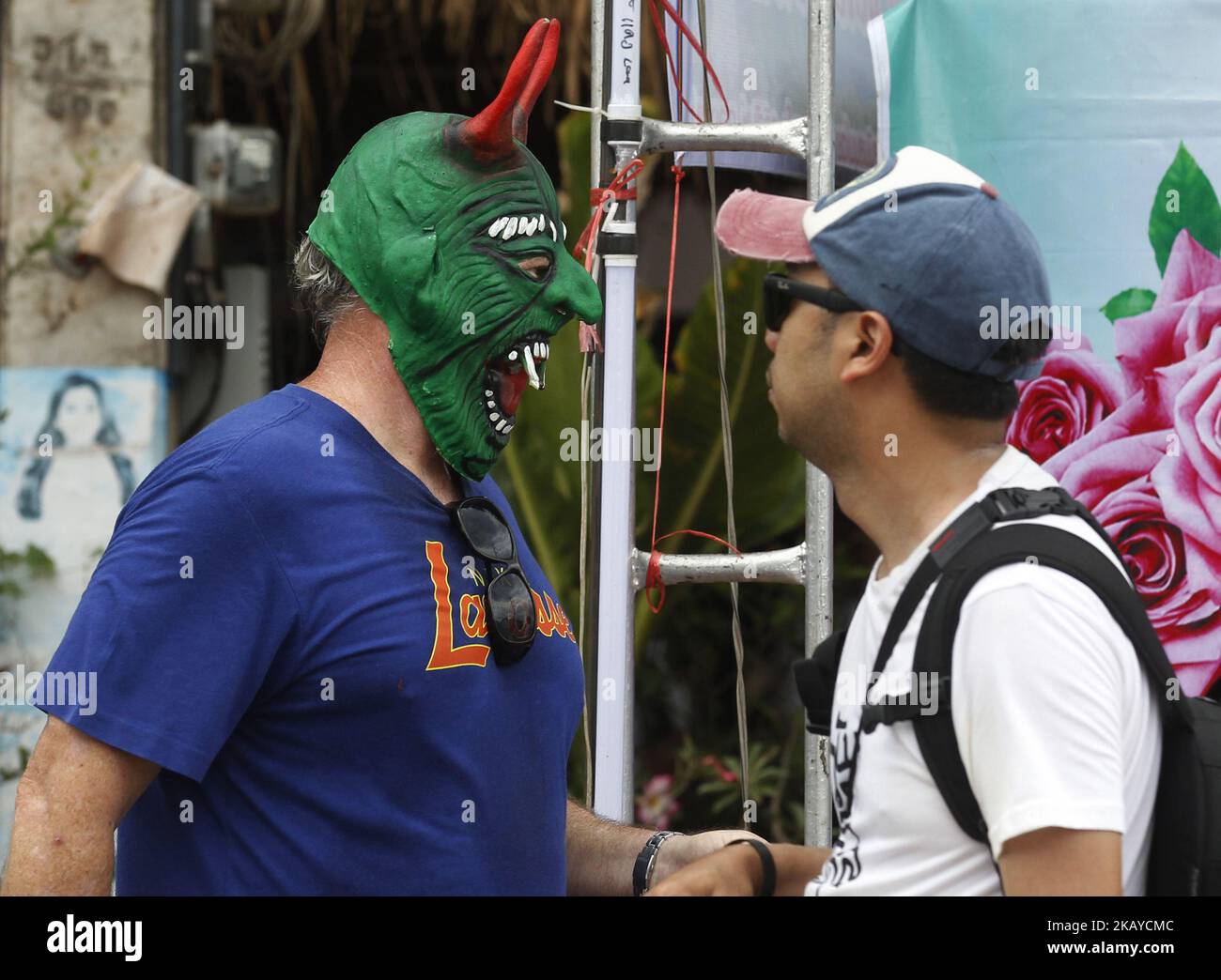 A tourist wear a mask representing the spirits of the dead springing back to life during the annual Phi Ta Khon, or Ghost festival in Dan Sai, Loei province, northeast of Bangkok on June 16, 2018. The event was held to promote tourism in Thailand. (Photo by Chaiwat Subprasom/NurPhoto) Stock Photo