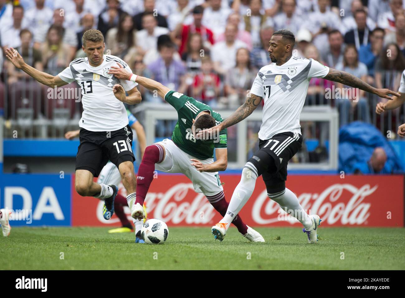 Thomas Mueller and Jerome Boateng of Germany with Hector Herrera of Mexico during the 2018 FIFA World Cup Russia Group F match between Germany and Mexico at Luzhniki Stadium in Moscow, Russia on June 17, 2018 (Photo by Andrew Surma/NurPhoto) Stock Photo