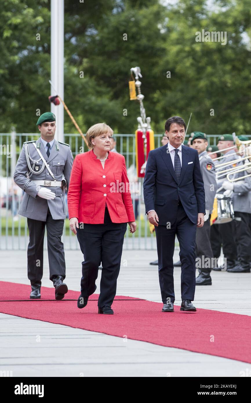 German Chancellor Angela Merkel and Italian Prime Minister Giuseppe Conte review the guard of honour at the Chancellery in Berlin, Germany on June 18, 2018. (Photo by Emmanuele Contini/NurPhoto) Stock Photo