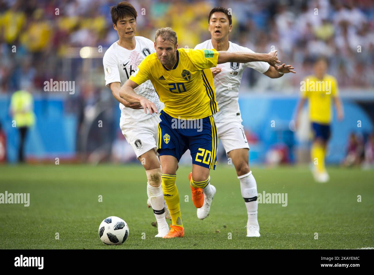 Ola Toivonen of Sweden fight for the ball with Ki Sungyueng and Jung Wooyoung of Korea during the 2018 FIFA World Cup Group F match between Sweden and Korea Republic at Nizhny Novogrod Stadium in Nizhny Novogrod, Russia on June 18, 2018 (Photo by Andrew Surma/NurPhoto) Stock Photo