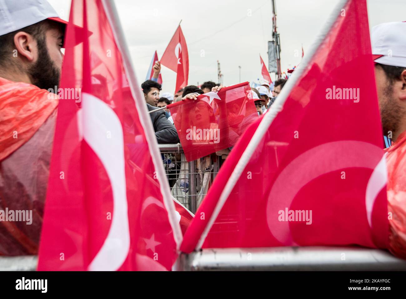 Supporters of Turkish President Recep Tayyip Erdogan greet during an ...