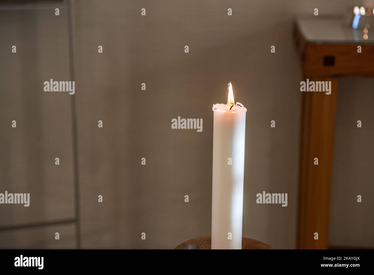 Single lit candle light in a church Stock Photo Alamy
