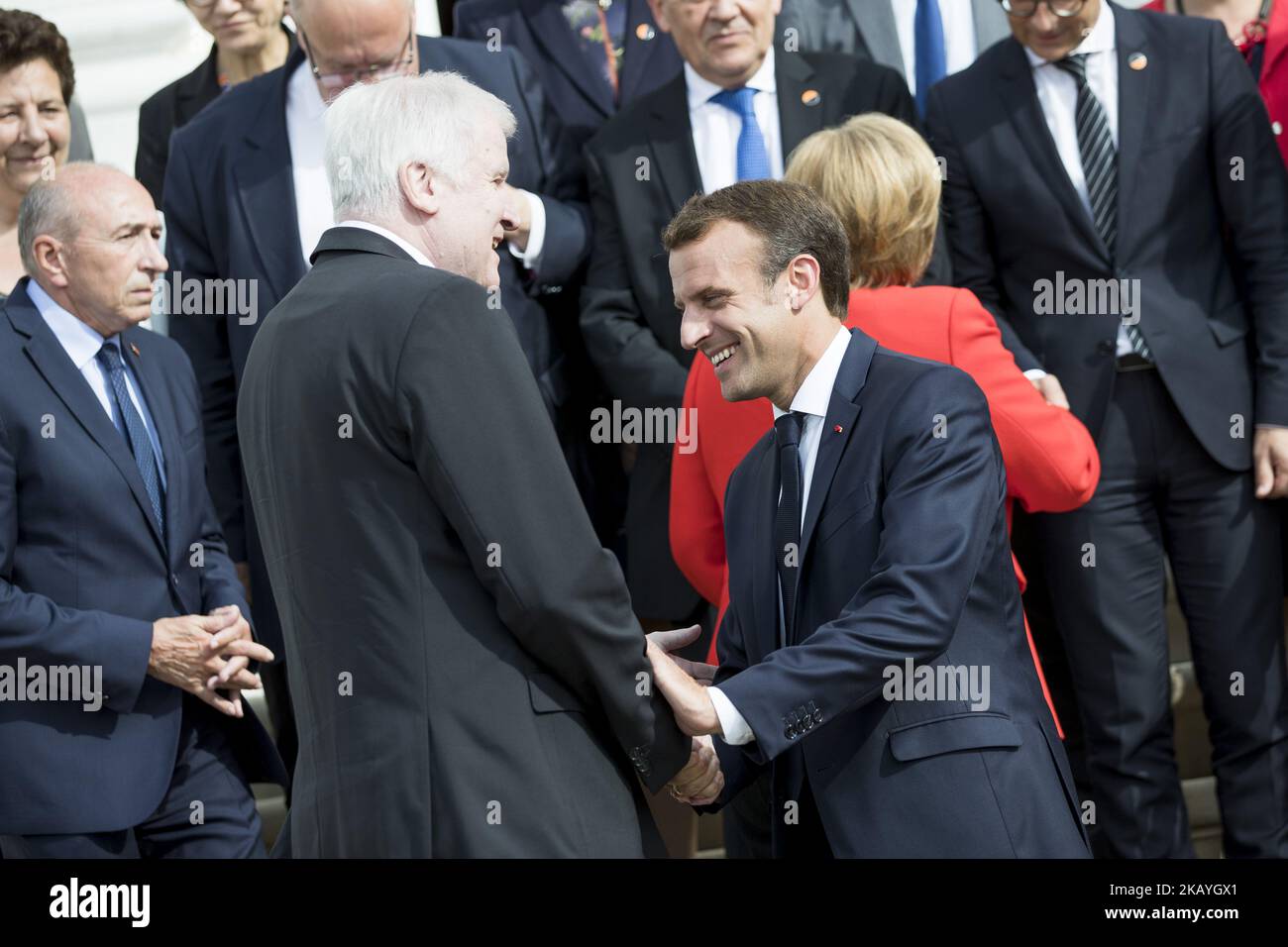 French President Emmanuel Macron greets German Interior Minister Horst Seehofer before posing for a family picture after a German-French Ministers Meeting in Meseberg, Germany on June 19, 2018. (Photo by Emmanuele Contini/NurPhoto) Stock Photo