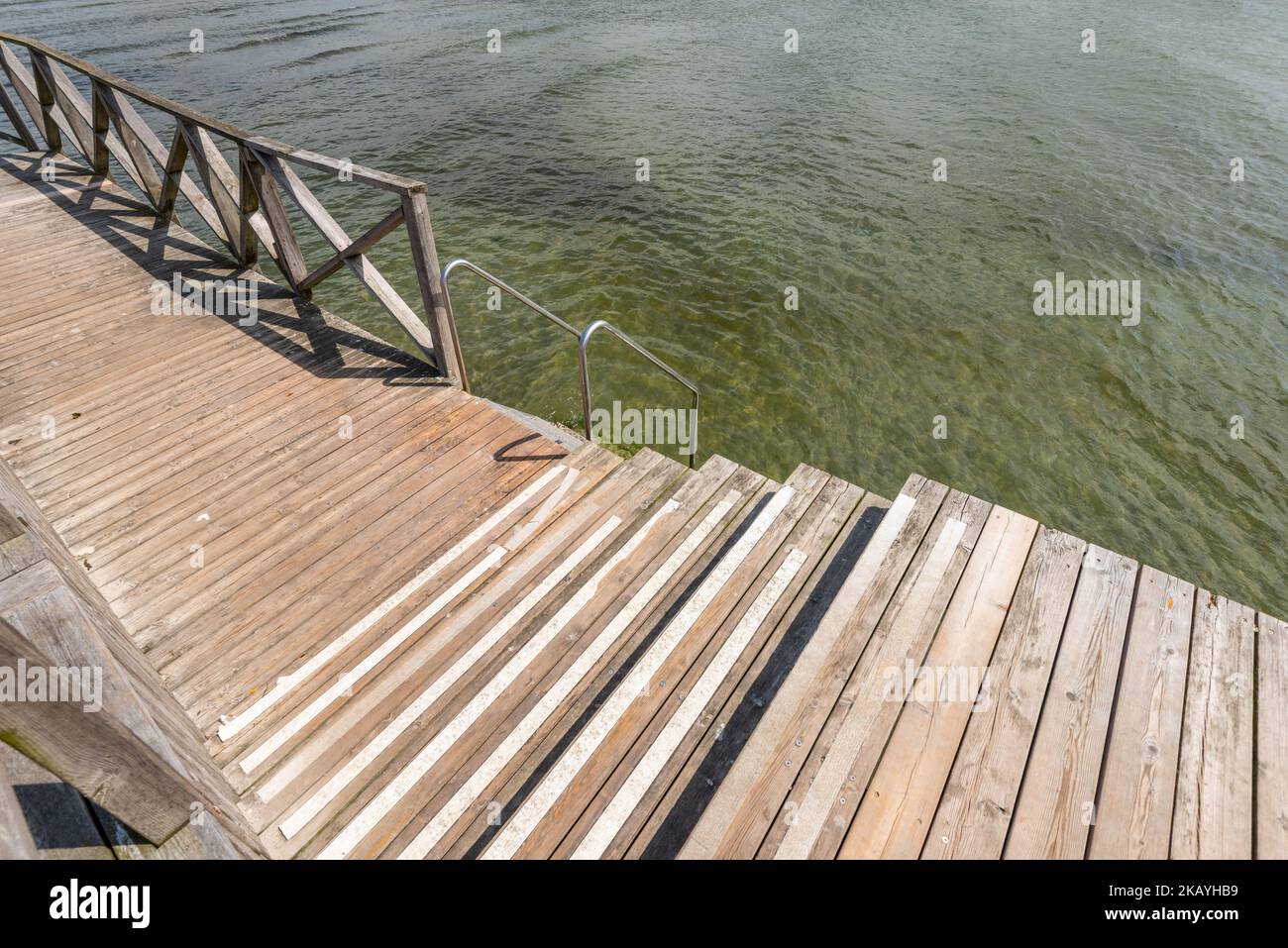 Ramp and ladder to the beach by clear sea water Stock Photo - Alamy