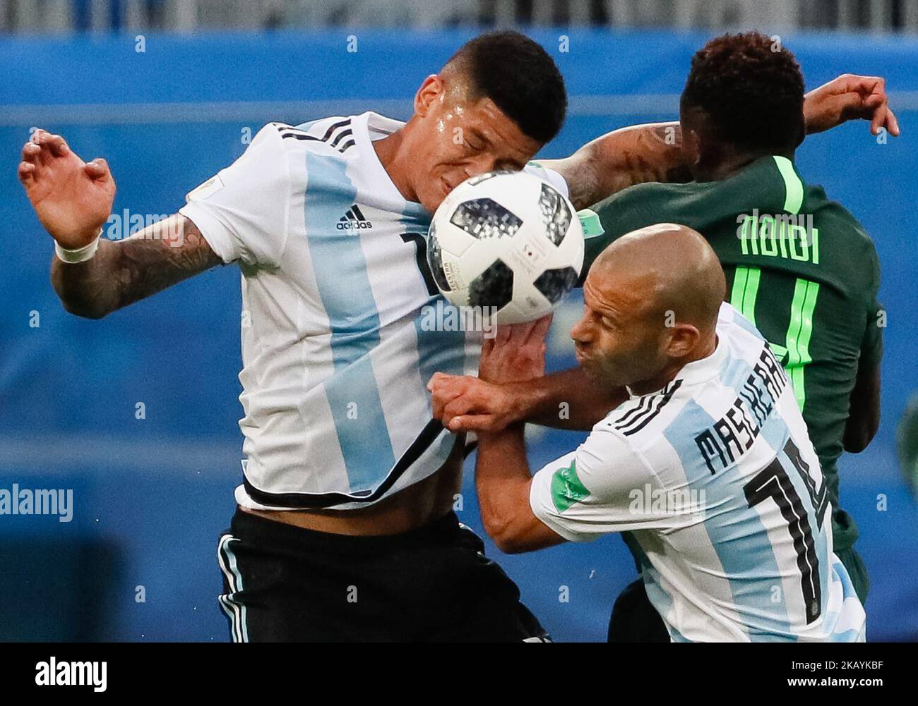 Onyinye Ndidi of Nigeria national team vies for a header with Marcos Rojo (L) and Javier Mascherano of Argentina national team during the 2018 FIFA World Cup Russia group D match between Nigeria and Argentina on June 26, 2018 at Saint Petersburg Stadium in Saint Petersburg, Russia. (Photo by Mike Kireev/NurPhoto) Stock Photo
