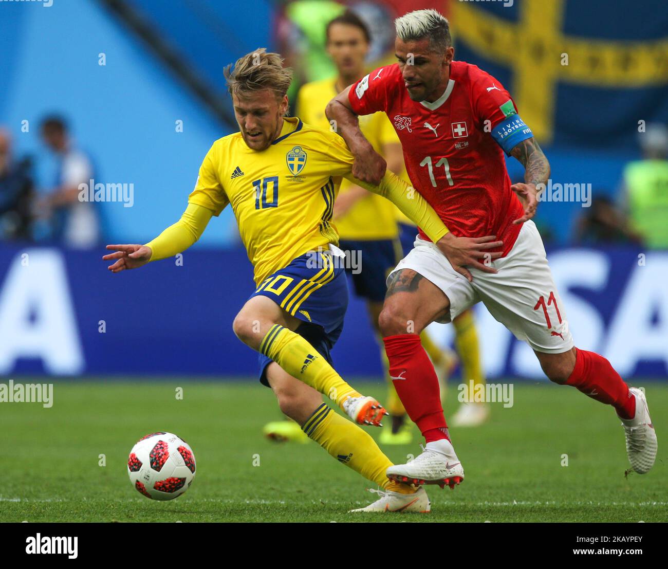 Valon Behrami (R) of the Switzerland national football team and Emil Forsberg of the Sweden national football team vie for the ball during the 2018 FIFA World Cup match, Round of 16 between Sweden and Switzerland at Saint Petersburg Stadium on July 03, 2018 in St. Petersburg, Russia. (Photo by Igor Russak/NurPhoto) Stock Photo