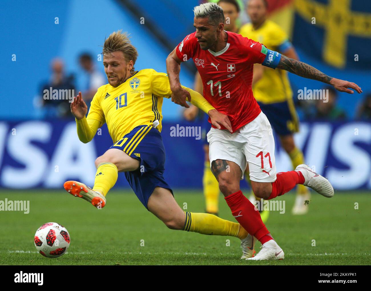 Valon Behrami (R) of the Switzerland national football team and Emil Forsberg of the Sweden national football team vie for the ball during the 2018 FIFA World Cup match, Round of 16 between Sweden and Switzerland at Saint Petersburg Stadium on July 03, 2018 in St. Petersburg, Russia. (Photo by Igor Russak/NurPhoto) Stock Photo