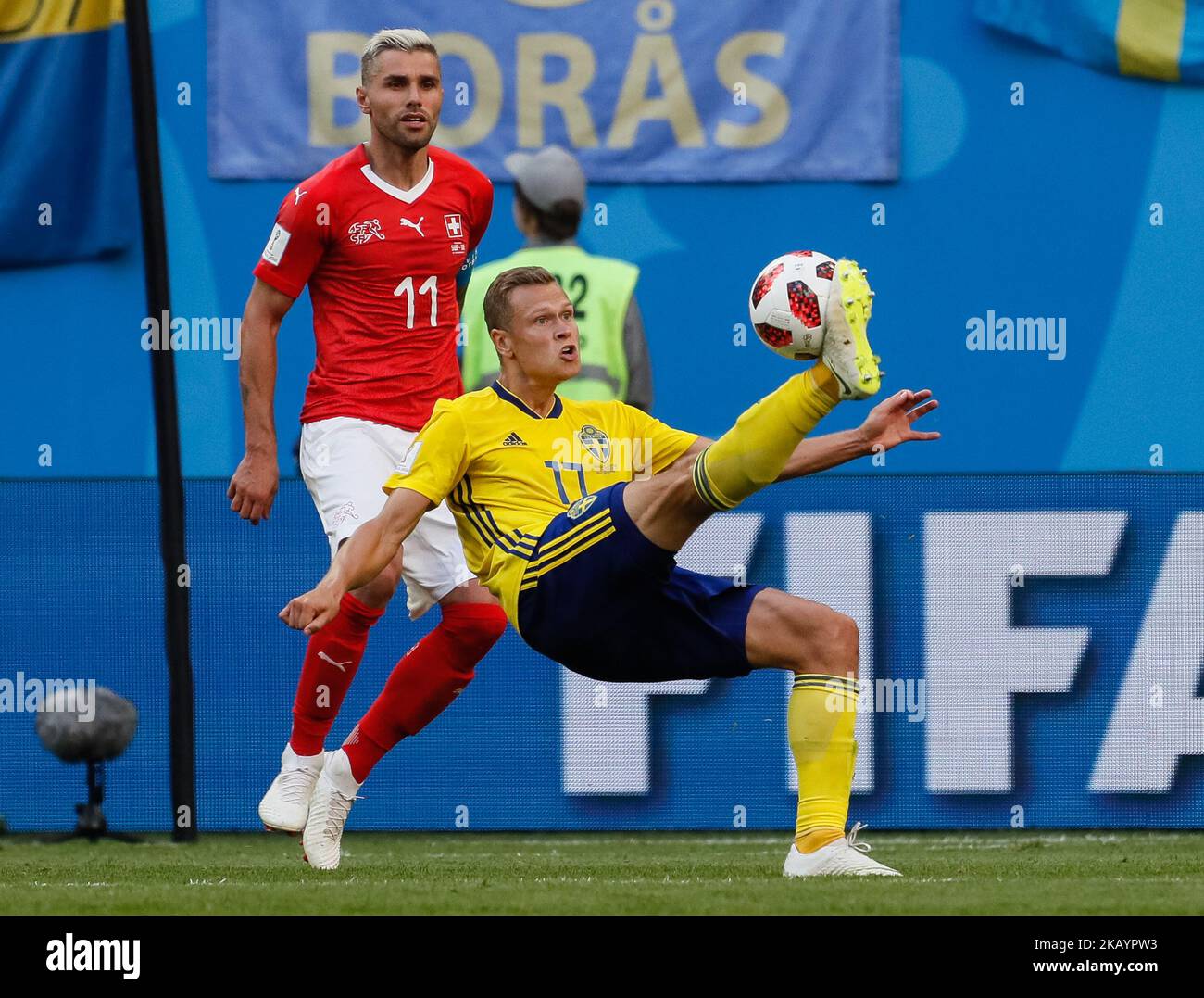 Viktor Claesson (R) of Sweden national team and Valon Behrami of Switzerland national team in action during the 2018 FIFA World Cup Russia Round of 16 match between Sweden and Switzerland on July 3, 2018 at Saint Petersburg Stadium in Saint Petersburg, Russia. (Photo by Mike Kireev/NurPhoto) Stock Photo