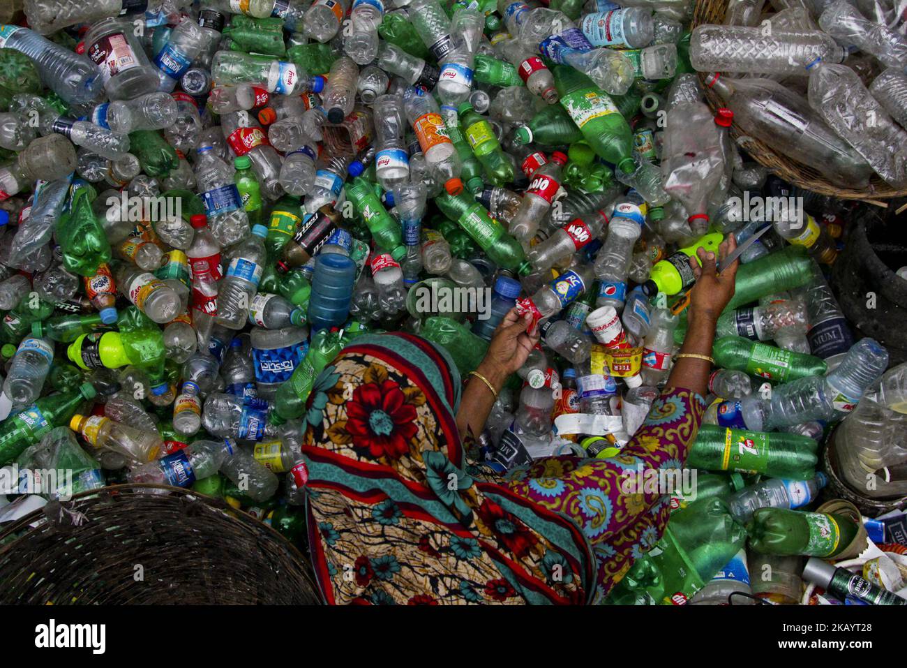 People at work in Plastic recycling factory, in Dhaka, Bangladesh, on July 4, 2018. (Photo by