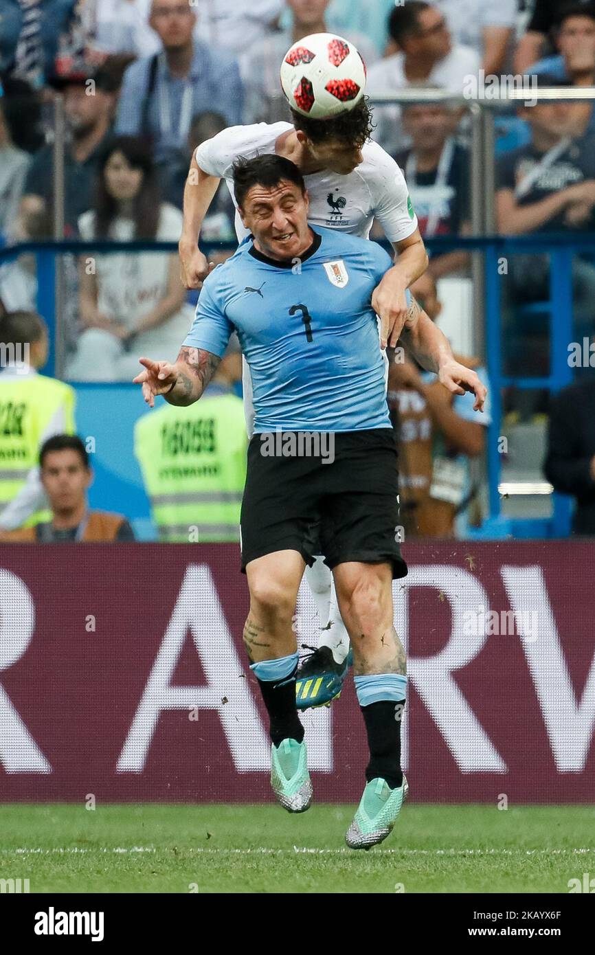 Cristian Rodriguez (in front) of Uruguay national team and Benjamin Pavard of France national team vie for a header during the 2018 FIFA World Cup Russia Quarter Final match between Uruguay and France on July 6, 2018 at Nizhny Novgorod Stadium in Nizhny Novgorod, Russia. (Photo by Mike Kireev/NurPhoto) Stock Photo