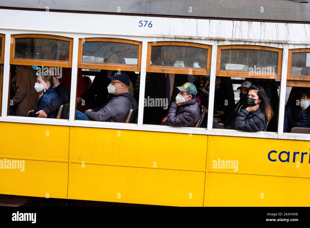 Passengers in face masks on the world famous trams in Lisbon, Portugal