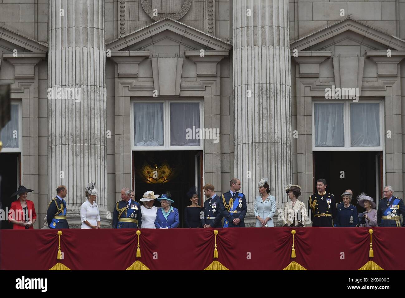 (L-R) Prince and Princess Michael of Kent, Prince Edward, Earl of Wessex, Sophie, Countess of Wessex, Prince Charles, Prince of Wales, Prince Andrew, Duke of York, Camilla, Duchess of Cornwall, Queen Elizabeth II, Meghan, Duchess of Sussex, Prince Harry, Duke of Sussex, Prince William, Duke of Cambridge, Catherine, Duchess of Cambridge, Anne, Princess Royal, Vice Admiral Sir Timothy Laurence, Prince Richard, Duke of Gloucester, Birgitte, Duchess of Gloucester, Prince Edward, Duke of Kent and Katharine, Duchess of Kent watch the RAF flypast on the balcony of Buckingham Palace, as members of the Stock Photo