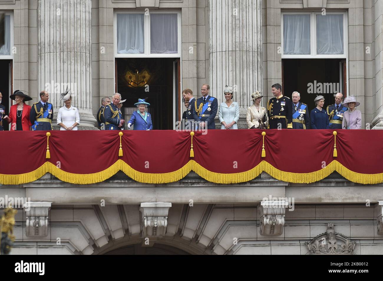 (L-R) Prince and Princess Michael of Kent, Prince Edward, Earl of Wessex, Sophie, Countess of Wessex, Prince Charles, Prince of Wales, Prince Andrew, Duke of York, Camilla, Duchess of Cornwall, Queen Elizabeth II, Meghan, Duchess of Sussex, Prince Harry, Duke of Sussex, Prince William, Duke of Cambridge, Catherine, Duchess of Cambridge, Anne, Princess Royal, Vice Admiral Sir Timothy Laurence, Prince Richard, Duke of Gloucester, Birgitte, Duchess of Gloucester, Prince Edward, Duke of Kent and Katharine, Duchess of Kent watch the RAF flypast on the balcony of Buckingham Palace, as members of the Stock Photo