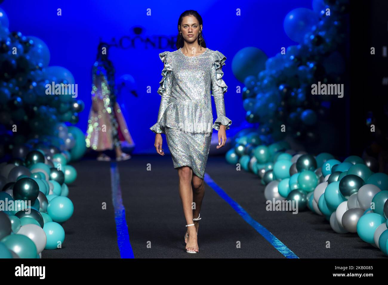A model walks the runway at the 'La Condesa' catwalk during the Mercedes-Benz Madrid Fashion Week Spring/Summer in Madrid, Spain. July 11, 2018. (Photo by Peter Sabok/NurPhoto) Stock Photo