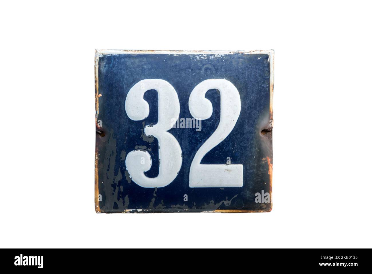 Weathered grunge square metal enameled plate of number of street address with number 32 isolated on white background Stock Photo