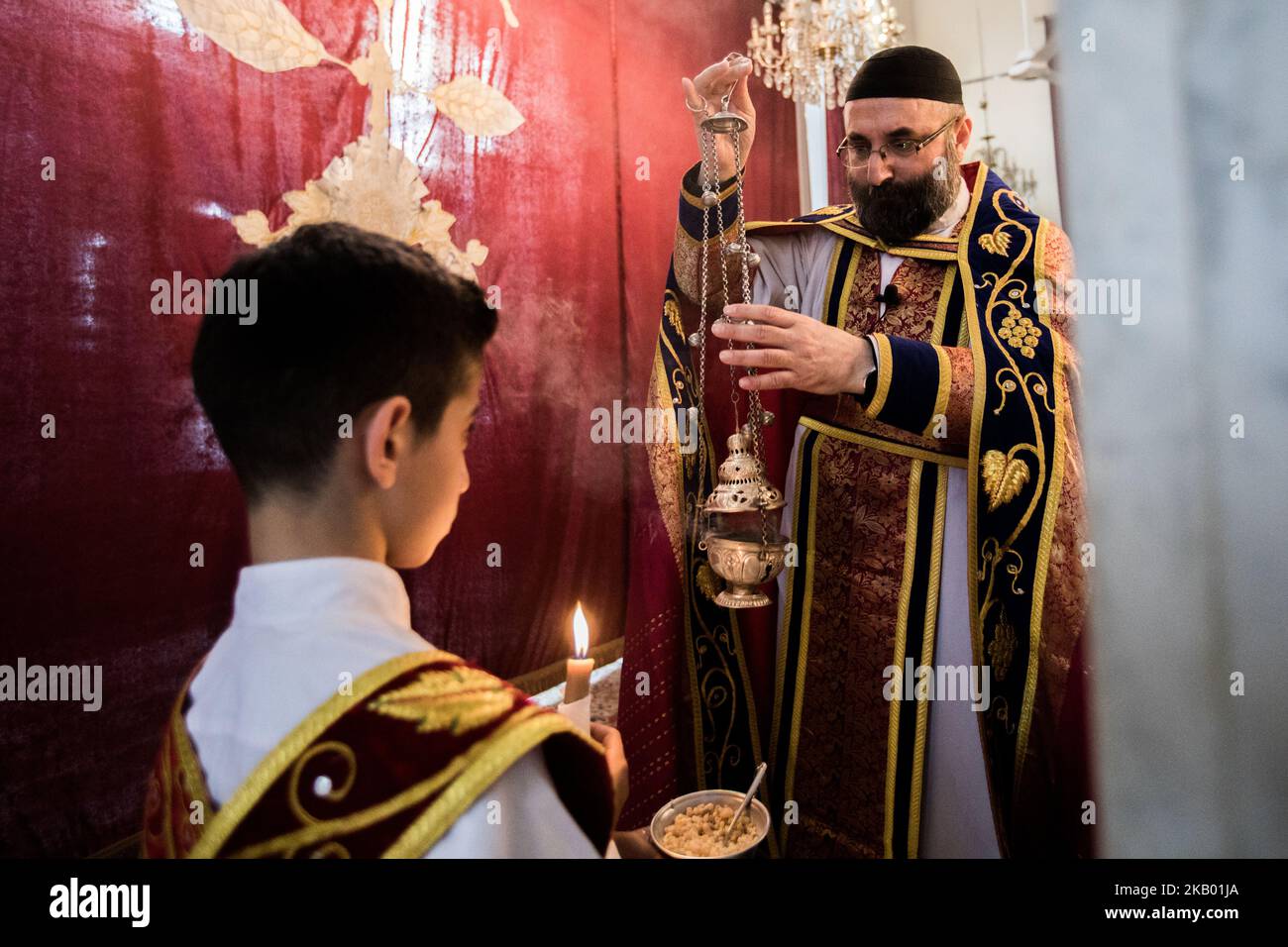 The priest of the congregation 'Mariam al-Adra' Abuna Saliba in his church in Qamishli in Syria (Photo by Sebastian Backhaus/NurPhoto) Stock Photo