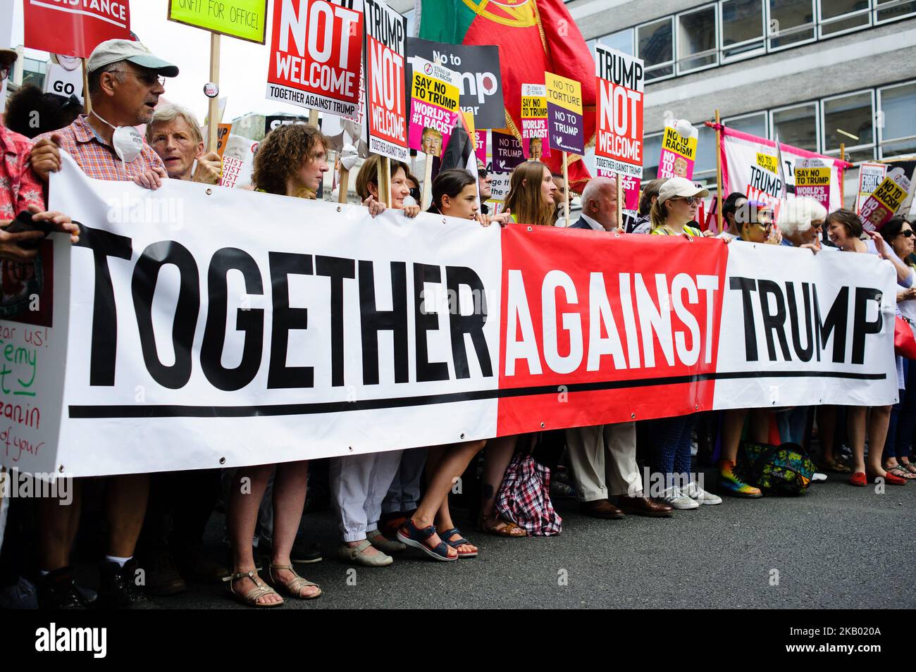 Demonstrators opposing the UK visit of US President Donald Trump protest in London, England, on July 13, 2018. President Trump arrived on British soil yesterday on his first visit to the UK since taking office. Protests have been planned across the country – today in London in particular, although Mr Trump is spending the day outside the city. (Photo by David Cliff/NurPhoto) Stock Photo