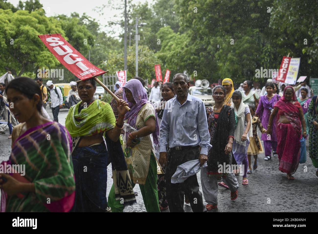 Students, teachers and activists of SUCI (C) participate in a rally from Mandi House to Parliament Street to protest against the 'No Detention Policy' in the schools on July 18, 2018 in New Delhi, India. As per No detention policy under the Right to Education Act no student can be failed or expelled from school till Class 8. (Photo by Indraneel Chowdhury/NurPhoto) Stock Photo