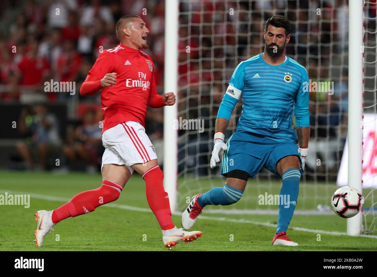 Benfica's forward Nicolas Castillo of Chile vies with Fenerbahce's goalkeeper Volkan Demirel during the UEFA Champions League 3rd Qualifying Round first leg match Benfica vs Fenerbahce at the Luz Stadium in Lisbon, Portugal on August 7, 2018. ( Photo by Pedro FiÃºza/NurPhoto) Stock Photo