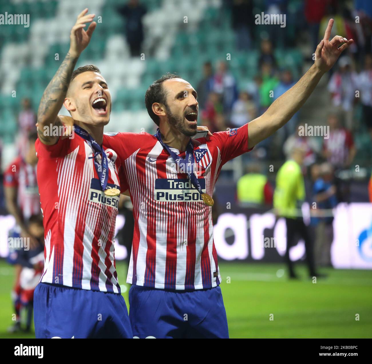 Atletico Madrid's Spanish defender Juanfran (R) celebrates the victory at the end of the UEFA Super Cup football match between Real Madrid and Atletico Madrid at the Lillekula Stadium in the Estonian capital Tallinn on August 15, 2018. (Photo by Raddad Jebarah/NurPhoto) Stock Photo