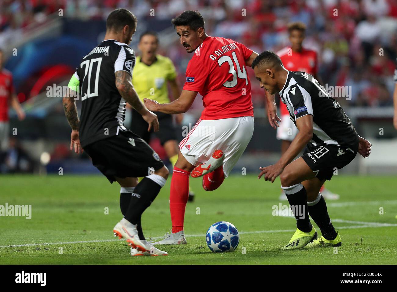 Benfica's Portuguese defender Andre Almeida (C ) vies with PAOK's midfielder Vieirinha from Portugal (L) and forward Leo Jaba from Brazil during the UEFA Champions League play-off first leg match SL Benfica vs PAOK FC at the Luz Stadium in Lisbon, Portugal on August 21, 2018. (Photo by Pedro FiÃºza/NurPhoto) Stock Photo