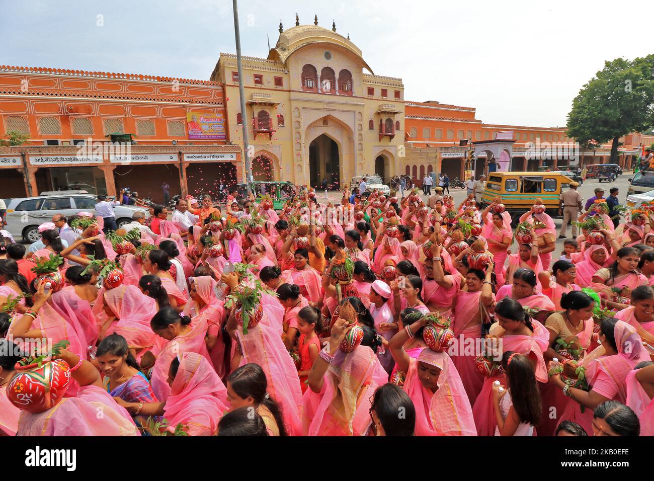 Lord Shiva devotees take part in the procession of Kalash and Kawad Yatra during the holy month of Sawan in Jaipur, Rajasthan, India, on August 19, 2018. Devotees carry holy water in the pots from river or shrine ponds to be poured on the Shivlinga in their hometown temples on the occasion of Sawan month.This journey on foot, when completed, is supposed to fulfill their wishes and endear them to Lord Shiva. (Photo by Vishal Bhatnagar/NurPhoto) Stock Photo