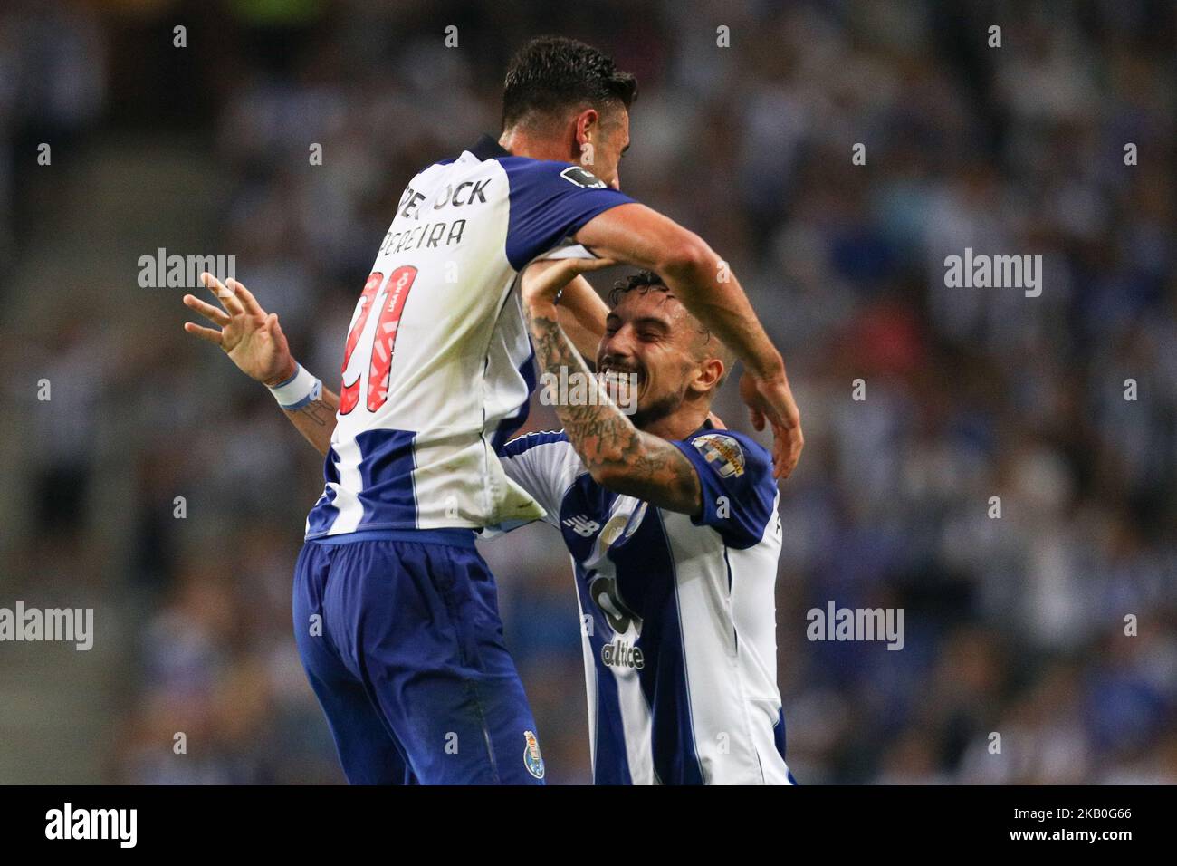 Porto's Portuguese forward Andre Pereira (L) celebrates after scoring a goal with Porto's Brazilian defender Alex Telles (R) during the Premier League 2018/19 match between FC Porto and Vitoria SC, at Dragao Stadium in Porto on August 25, 2018. (Photo by Paulo Oliveira / DPI / NurPhoto) Stock Photo