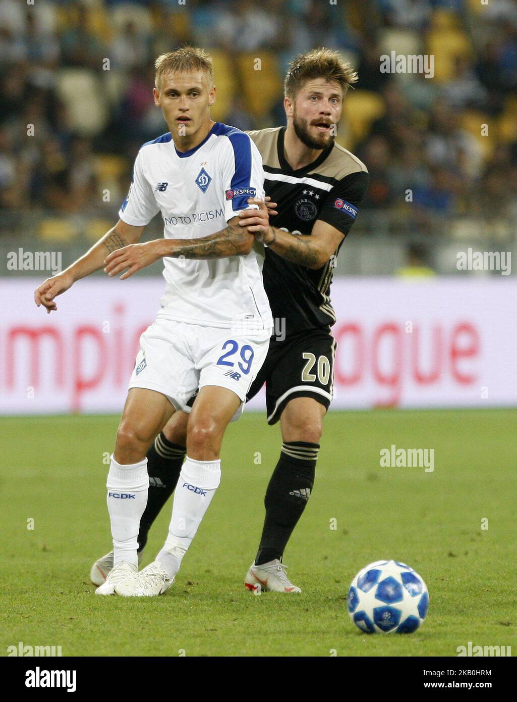 Vitaliy Buyalskiy of Dynamo (L) vies for the ball with Lasse Schone (R) of Ajax, during the UEFA Champions League play-off, second leg soccer match between Ajax Amsterdam and FC Dynamo Kyiv, on the NSC Olimpiyskiy stadium in Kiev, Ukraine, 28 August,2018. (Photo by STR/NurPhoto) Stock Photo
