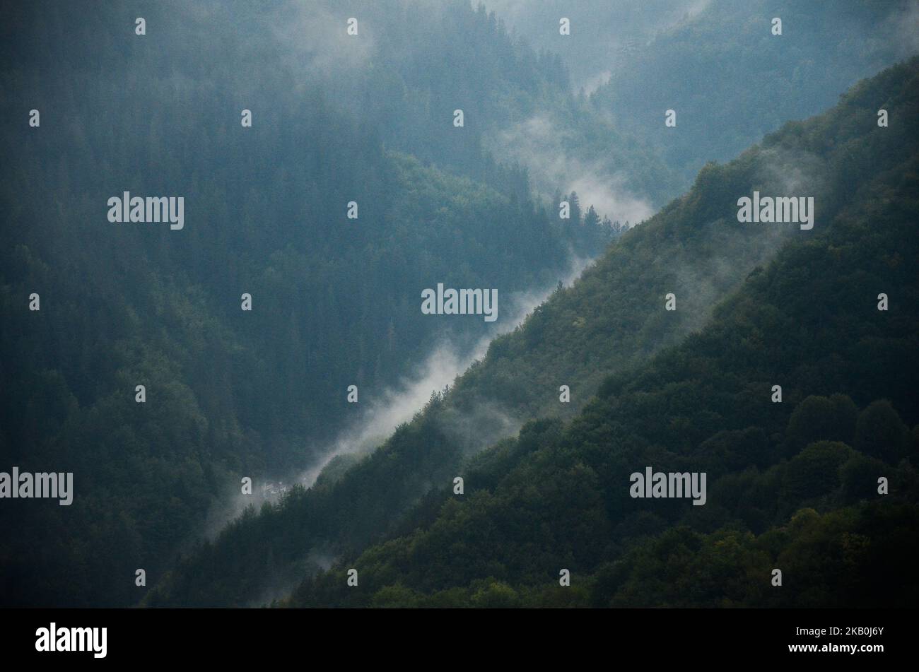 Mist lift above the Rhodope mountains near the Orlovo oko famous viewpoint, near the village of Yagodina, Bulgaria on August 27, 2018. Orlovo oko (Eagle's eye) is a sightseeing platform built at 1563 m above the sea level, next to the St.Ilia peak in the Rhodope mountains and close to the village of Yagodina and the famous Yagodina cave, Bulgaria on August 29, 2018 (Photo by Hristo Rusev/NurPhoto) Stock Photo