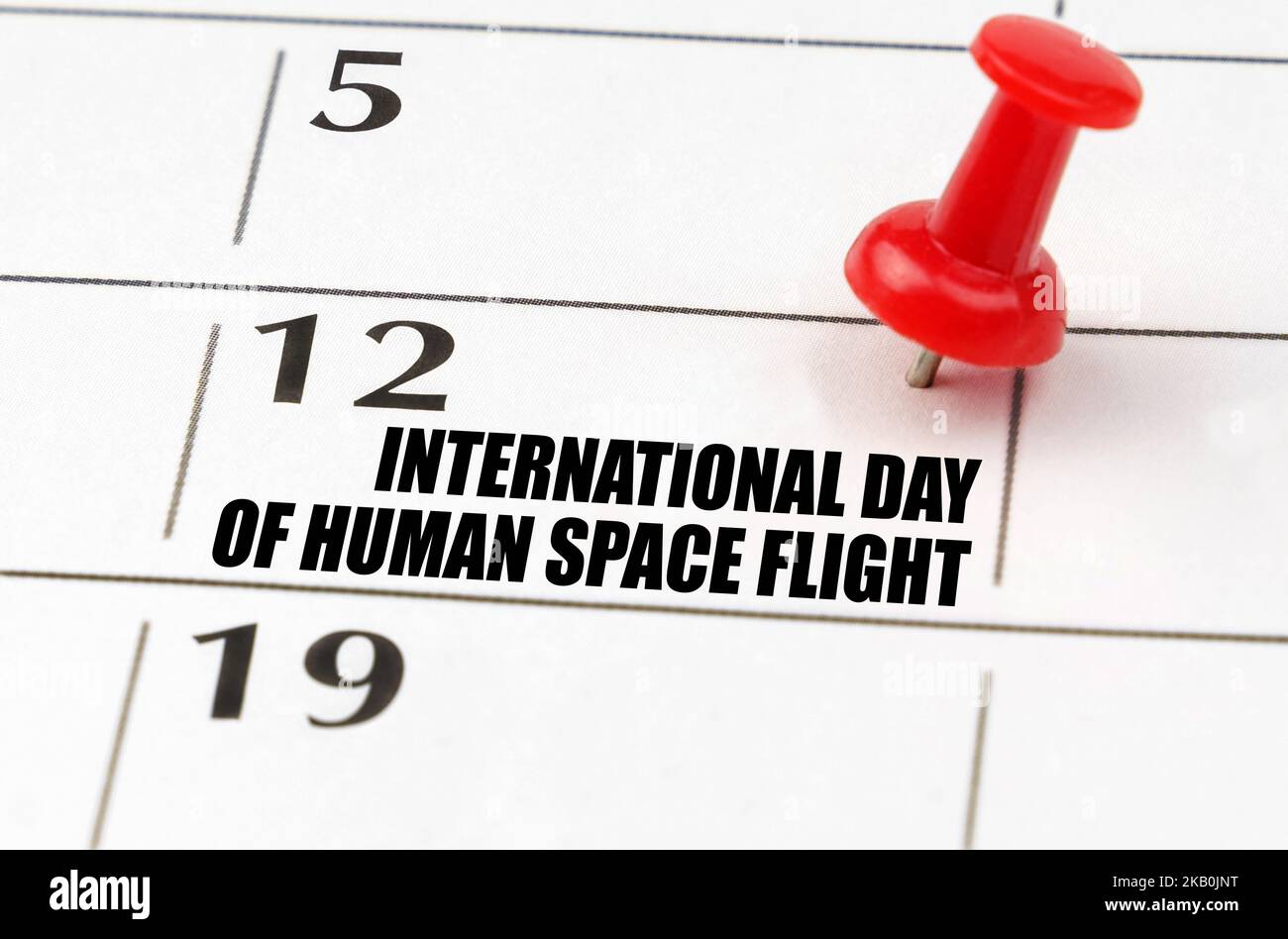International holidays. On the calendar grid, the date and name of the holiday - International Day of Human Space Flight Stock Photo