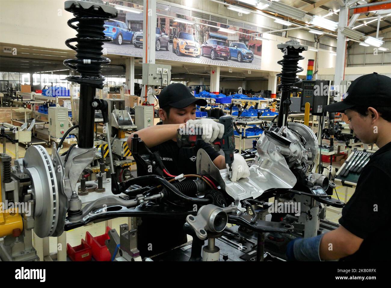 Workers assembly New MINI Countryman parts at BMW Group Production Network 2 PT Gaya Motor manufacture in Jakarta, Indonesia on September 6, 2018. This is the first batch of Indonesia-assembled New MINI countryman brand by PT Gaya Motor in Indonesia since the brand launching in 2011. (Photo by Anton Raharjo/NurPhoto) Stock Photo
