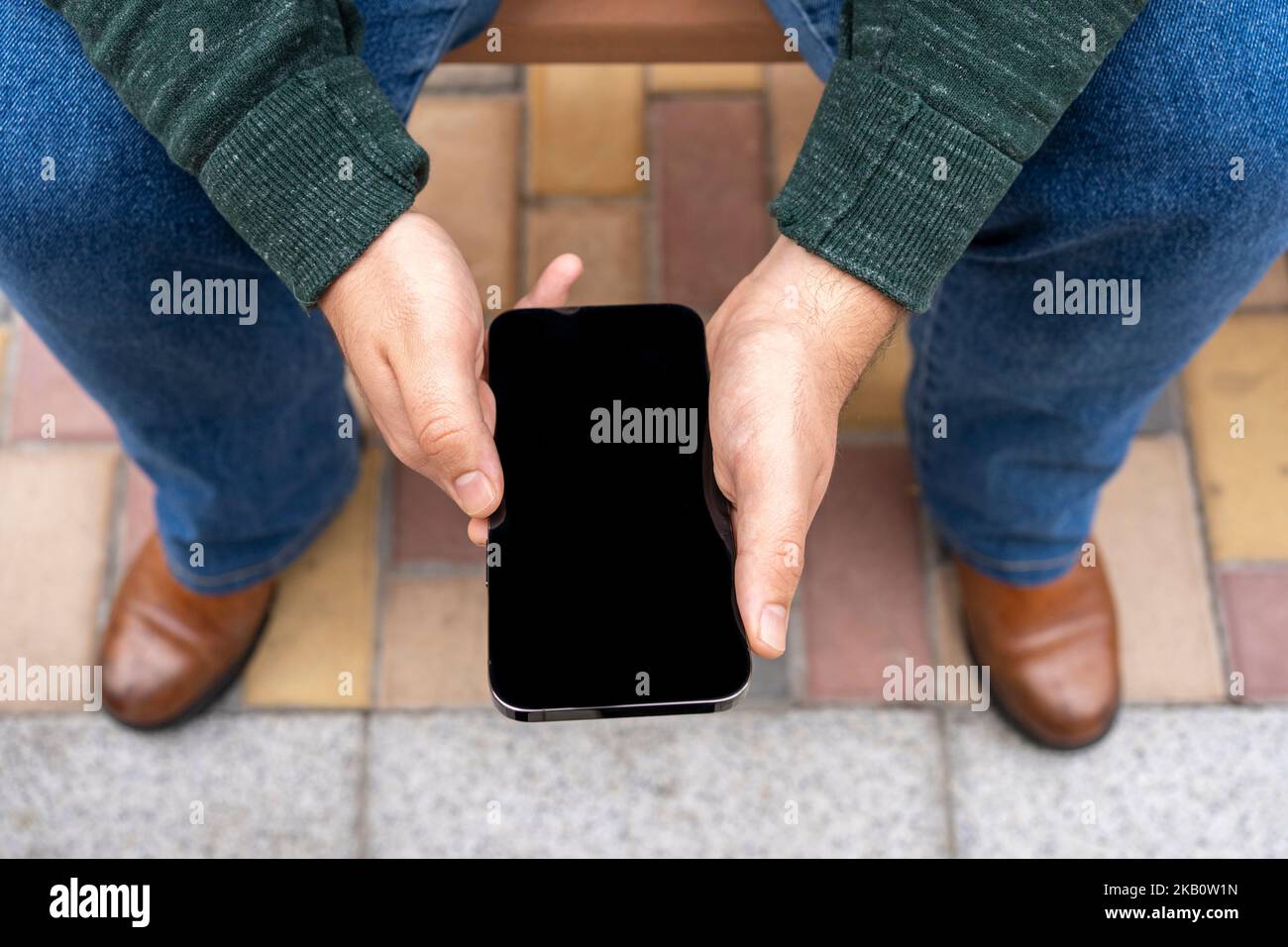 Mockup image black screen mobile phone.man holding texting using mobile relax Stock Photo