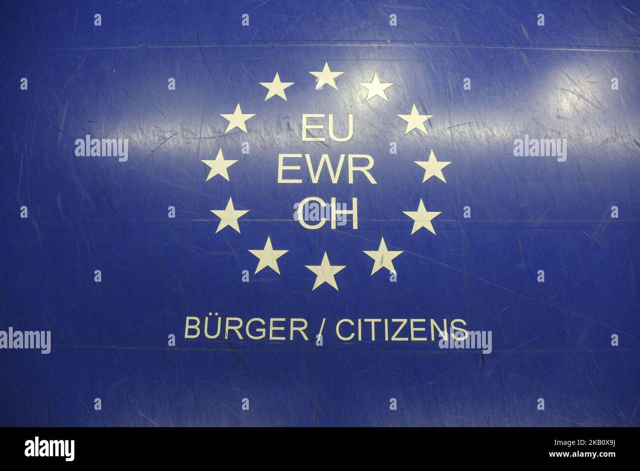 EU citizen signs at the arrivals in Dusseldorf International Airport in Germany. There are special lanes to passport control, immigration for EU citizens - eu / ewr / ch. The signs are separating lines between All Passports, EU, Schengen passports or Other Nationalities. (Photo by Nicolas Economou/NurPhoto) Stock Photo