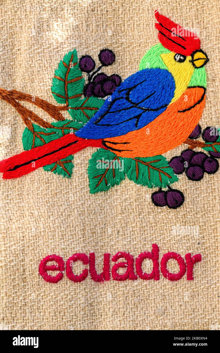 Hand made textile with an image of a cardinal bird woven into it. Made in Ecuador. Stock Photo