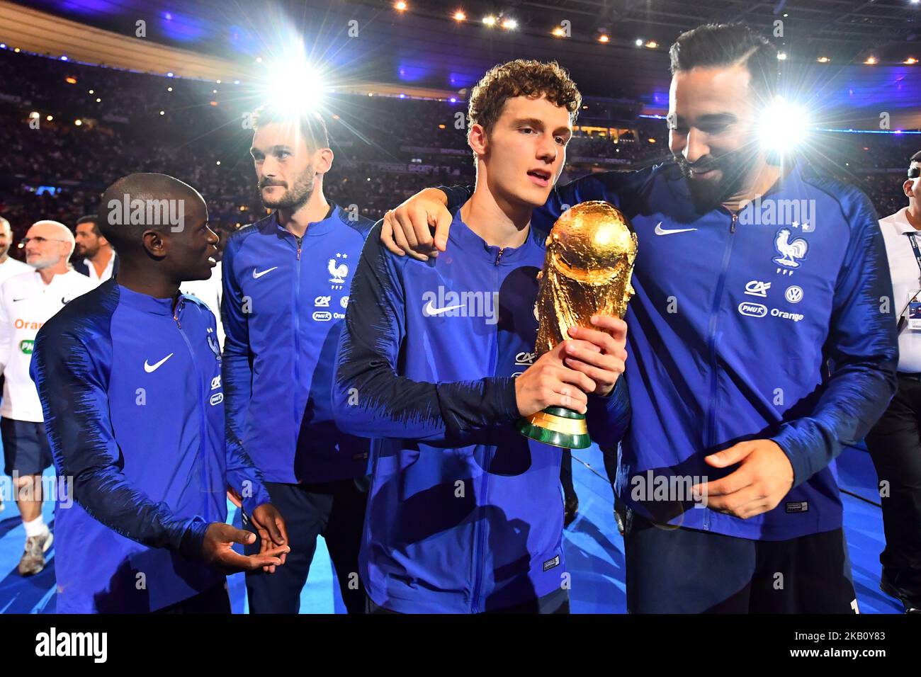 Benjamin Pavard, Adil Rami of France celebrate with the World Cup Trophy after the UEFA Nations League A group official match between France and Netherlands at Stade de France on September 9, 2018 in Paris, France. This is the first match of the French football team at the Stade de France since their victory in the final of the World Cup in Russia. (Photo by Mehdi Taamallah / NurPhoto) Stock Photo
