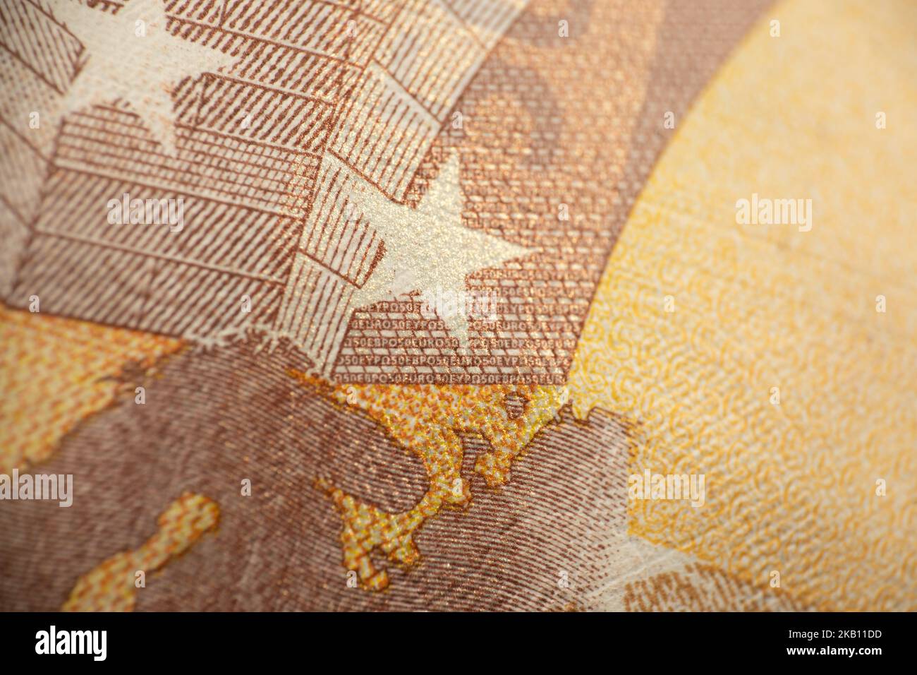 Close up macro fragment part of euro star symbol on 50 euro money banknote. World money concept, inflation and economy concept. Finance and business. Stock Photo