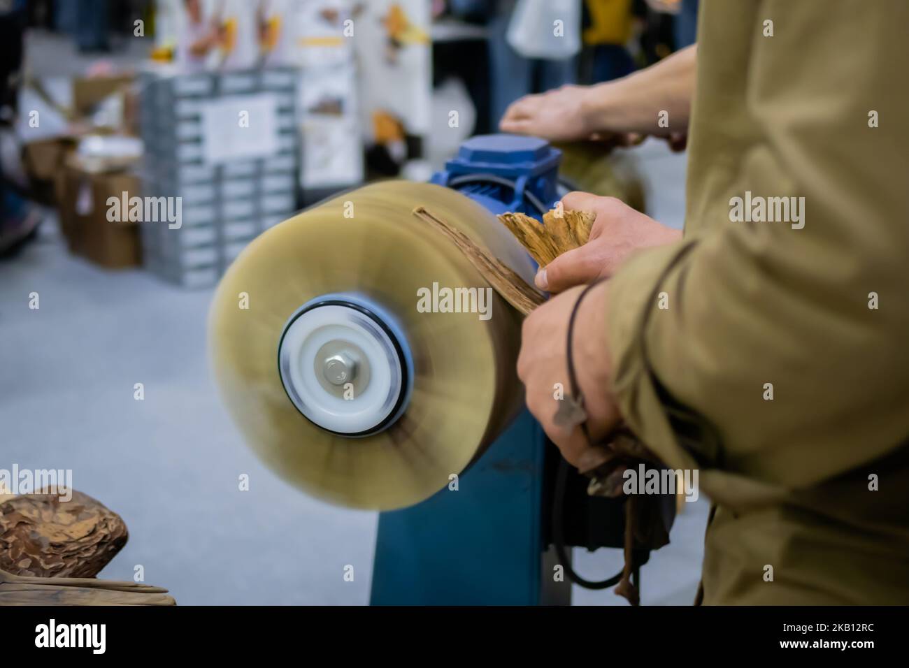 Professional man carpenter hands using belt sander machine Stock Photo