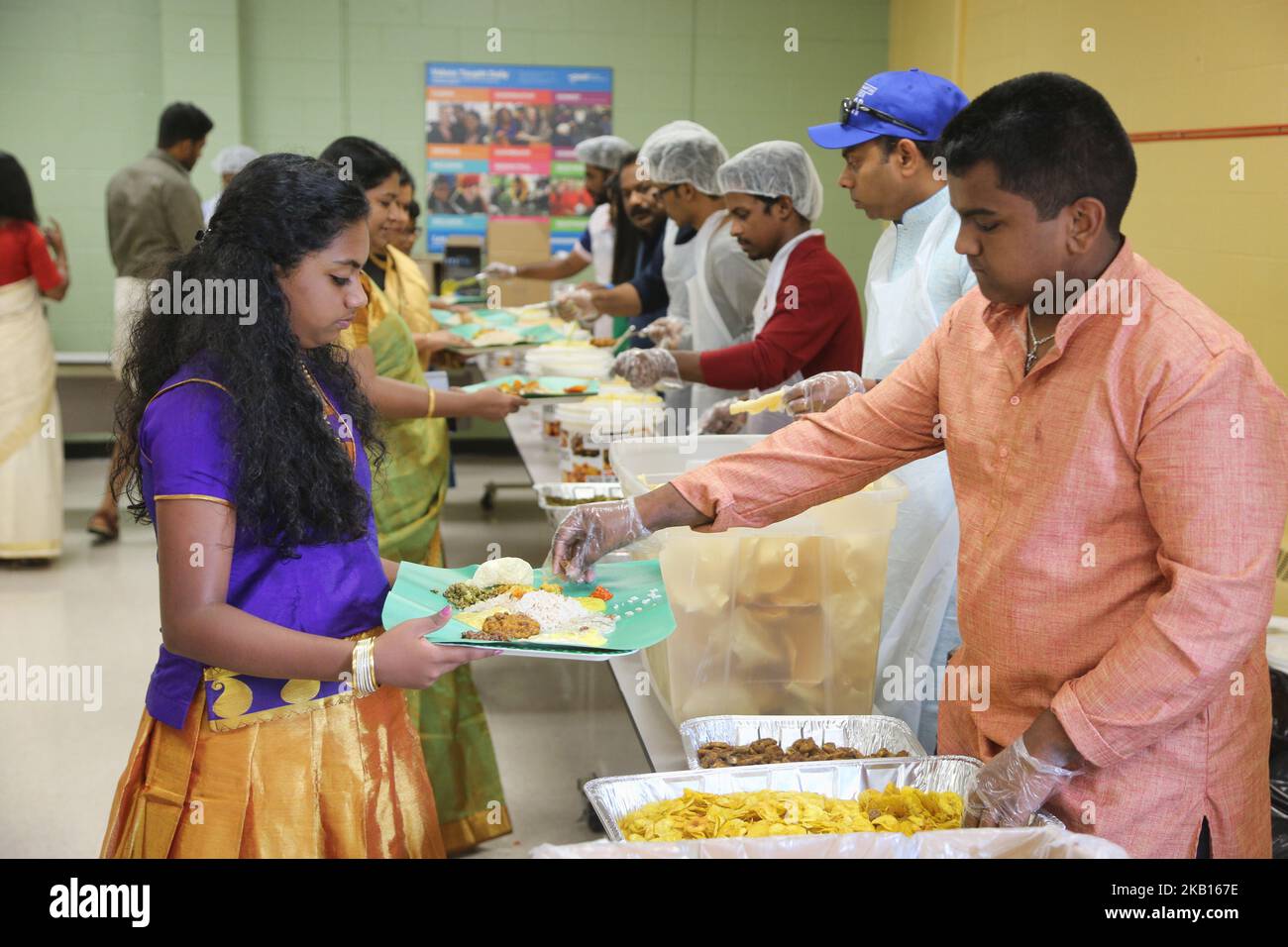 Traditional Sadhya meal is served as members of the Canadian Malayalee community held a fundraiser for the victims of the floods in Kerala, India. the fundraiser was held on September 15, 2018 in Mississauga, Ontario, Canada and hundreds came to give their support. Heavy rain in resulted in over 800,000 people being displaced and more than 373 people being killed in what has been called the worst flooding in Kerala in nearly a century. All 14 districts of the state were placed on high alert and thirty-five out of the forty-two dams within the state were opened for the first time in history. (P Stock Photo