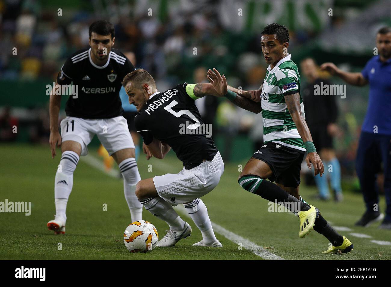 Raphinha of Sporting (R) vies for the ball with Maksim Medvedev of Qarabag FK (C) and Mahir Madatov of Qarabag FK (L) during Europa League 2018/19 match between Sporting CP vs Qarabagh FK, in Lisbon, on September 20, 2018. (Photo by Carlos Palma/NurPhoto) Stock Photo