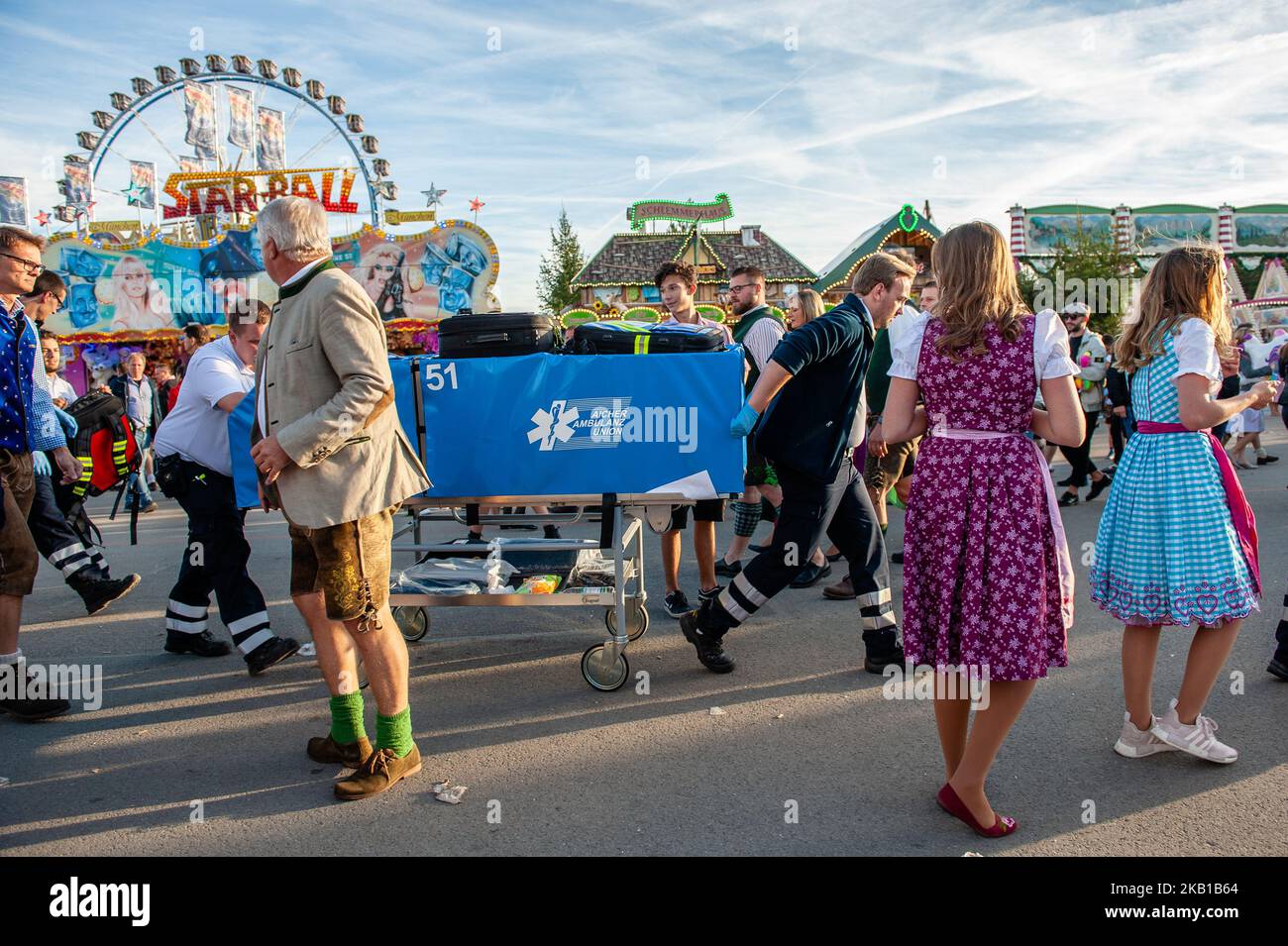 Visitors celebrate as they get their first beer mug in a beer tent at the opening day of the 2018 Oktoberfest beer festival on September 22, 2018 in Munich, Germany. The Oktoberfest is now one of the biggest and most popular festivals in the world. More than six million people visit the Oktoberfest every year. And they come from all over the world. As well as Italians, you will often meet Americans, Australians and the Japanese in particular. The Oktoberfest includes massive beer tents, each run by a different Bavarian brewer, as well as amusement rides and activities. (Photo by Romy Arroyo Fe Stock Photo